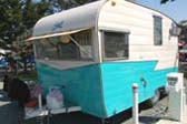 Cool Sunbrella Striped Awning on Dining Window of 1962 Shasta Trailer